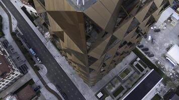 Office building windows and aerial view of skyscraper building. Stock footage. Bronze glass facade high rise building. photo