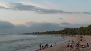 Bali, Indonesia 2020 Coronavirus COVID-19 Pandemic New Normal in Holiday Island, People Flocking Gathering at Kuta Beach Time Lapse video