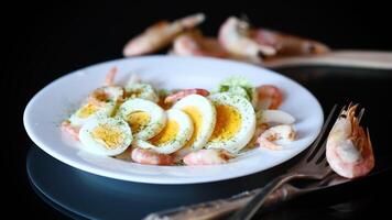 boiled eggs with boiled shrimp in a plate for breakfast video