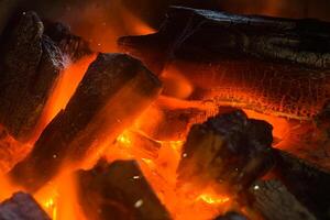 Close up of Charcoal burning. photo