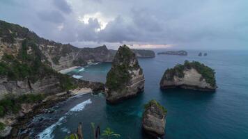 Bali Nusa Penida Island Indonesia Beautiful Nature Diamond Beach Cliff from Thousand Islands View Point Cloudy Sunrise Time Lapse video