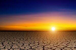 Arid soil with the sunset sky. photo