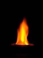 Close up of fire in the dark background photo