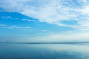 White cloud over the lake with blue sky. photo