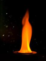 Close up of fire in the dark background photo