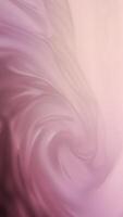 Vertical video - elegant flowing soft silk satin liquid or fabric in pastel pink colors. This stylish romantic motion background texture animation is full HD and a seamless loop with copy space.