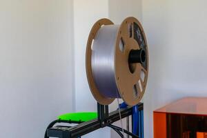 Spool of pla filament for printing 3d printer, material coils photo
