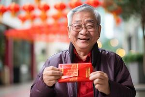 AI generated chinese grandpa wearing traditional suit and holding aungpao bokeh style background with generative ai photo
