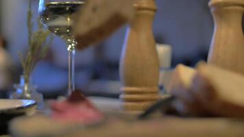 Close up view of meal table when woman hand spreading pate on wholegrain bread video