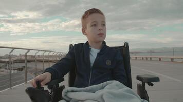 Calm handicapped child outdoor in the city video
