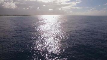 Aerial shot of sailing yacht in bright sunlight video