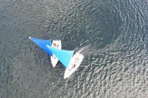 High Angle footage of People are Boating at Caldecotte Lake Located at Milton Keynes City of England Great Britain UK. The Aerial Landscape Was Captured on August 21st, 2023 with Drone's Camera photo