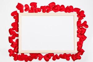 Valentine's day greeting card. Frame from red hearts on a white background. Layout with place for text. photo