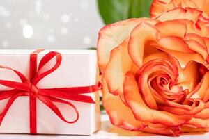 Beautiful yellow roses and gift box. Valentine's day concept. photo