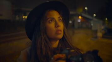 Young Woman Photographer Take Pictures On Urban Street at Night Light video