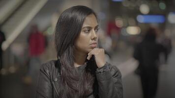 Beautiful Young Woman Looking at People Commuting in the City at Night video