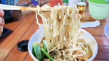 Chicken noodles in a plastic bowl packaging photo