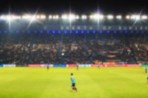 Blurry de-focused stadium football  twilight background. photo