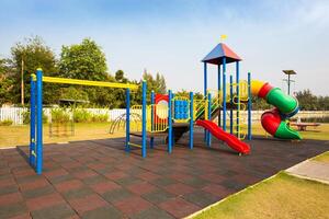 Colorful playground on yard in the park. photo