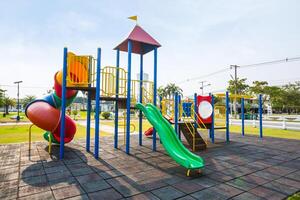 Colorful playground on yard in the park. photo