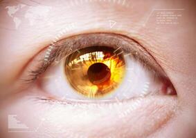 Woman's golden eye the futuristic, contact lens. photo