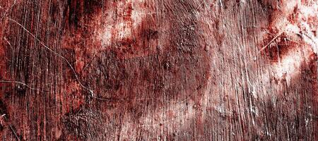 Red dirty wall grunge texture. Abstract scary concrete, Horror cement for background. old concrete wall. Grunge background for design. Distressed, blood, cracked, broken, crumbled photo