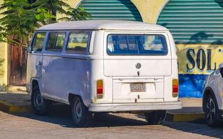 Puerto Escondido Oaxaca Mexico 2023 Old vintage classic minibuses vans transporters vehicles cars in Mexico. photo