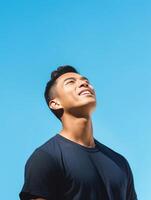 AI Generative Candid of young attractive asian man close eyes deep breath and wide open arms in blue sky view background feeling wind and sunshine Happy asian hipster male in youth freedom cultu photo