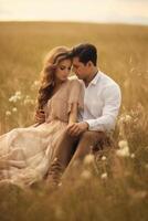 AI Generative Beautiful and young sensual couple are kissing outdoor in summer wheat field photo