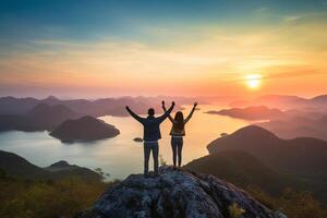 AI Generative Couple traveler on mountain summit enjoying nature view with hands raised over clouds  Sport travel business and success leadership and achievement concept photo