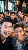 AI Generative Group of friends covered by face masks taking a selfie with smart phone mobile indoor  New normal friendship concept with young people having fun together at restaurant photo
