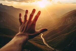 AI Generative Hand of a man reaching out the beatiful mountain landscape at sunset  Inspirational and travel concept photo