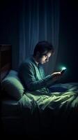 AI Generative Picture of young man using a smartphone and smiling lying on the bed at night photo