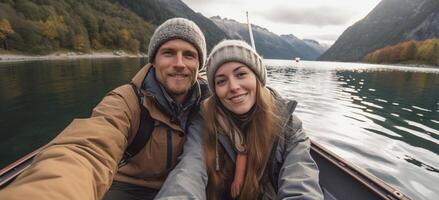 AI Generative Romantic couple of adults in love taking a selfie on a boat visiting an alpine lake at Braies Italy at autumn photo