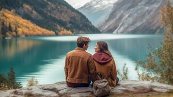 AI Generative Romantic couple of adults visiting an alpine lake at Braies Italy Tourist in love spending loving moments on a mountains background Couple wanderlust and travel concept photo