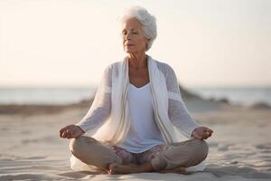 AI Generative Senior woman doing yoga exercise at beach  Calm and meditation concept photo