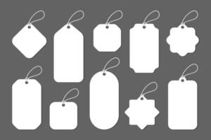 Blank white paper price tags or gift tags in various shapes vector