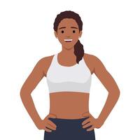 Young woman with a toned body in Fitness suit or sports bra with her hands on hips. vector