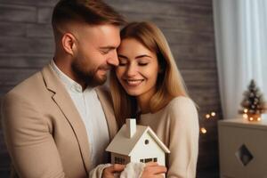 AI Generated Portrait happy smiling romantic couple boyfriend girlfriend family dreaming holding house model indoors. Real estate investing private property mortgage rent apartment sale buying flat photo