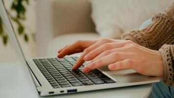 Close up female hands of unrecognizable business woman professional user worker using typing on laptop. Cropped view unknown girl working with computer keyboard sit at home office working online chat photo