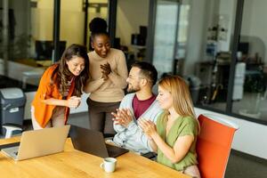 Young multiethnic startup team working in the modern office photo