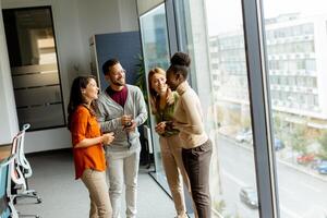 Young multiethnic startup team working in the modern office photo