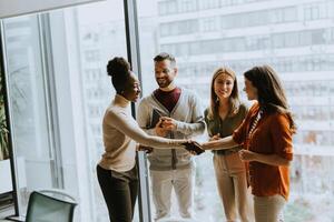 Young multiethnic startup team working in the modern office photo