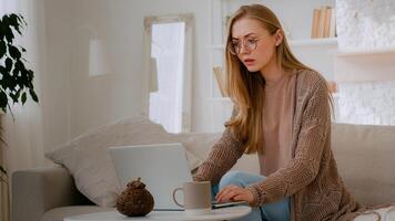 Caucasian shocked girl in glasses feel shock reading bad news woman lost with laptop worry about loosing online with computer terrible information mail Internet app problem business failure at home photo