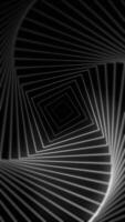 Vertical video - minimalist black and white geometric background with gently radiating and twisting square shapes. This abstract spiral motion background is full HD and a seamless loop.