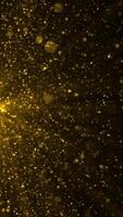 Vertical video - abstract background animation with glittering shiny gold particles and shimmering light rays. This sparkling golden motion background animation is full HD and a seamless loop.