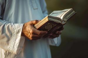 AI generated muslim man's hand holding quran with generative ai photo