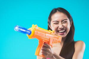 ai generado un mujer jugando agua pistola a Songkran día con generativo ai foto