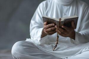 AI generated muslim man's hand holding quran with generative ai photo