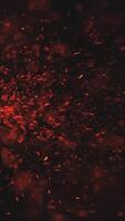 Vertical video - burning red hot sparks and embers fire background animation - fiery glowing red sparks exploding. Full HD hot fire particles motion background.